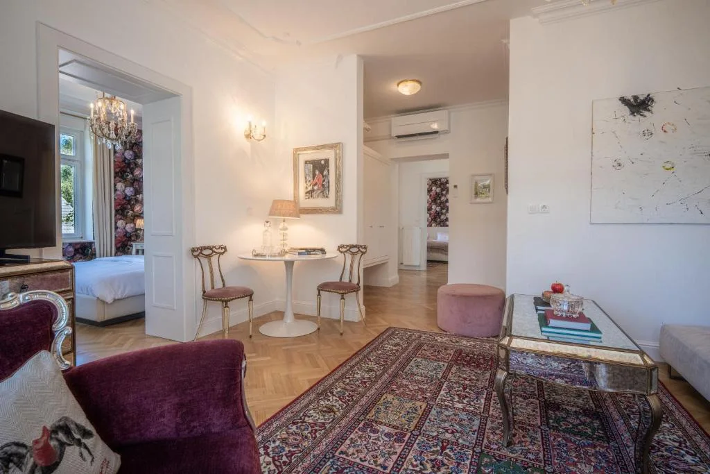 Executive Suite living room with a sofa and armchair