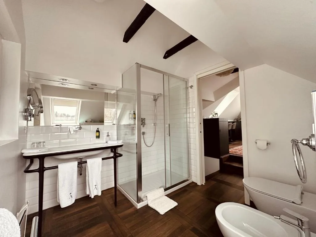 Penthouse bathroom with a glass shower enclosure