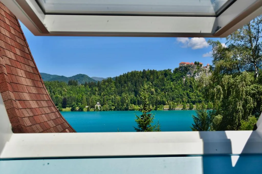 View of Lake Bled through a Penthouse roof window